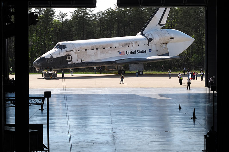 Final wheels stop: Space shuttle Discovery enters the Smithsonian