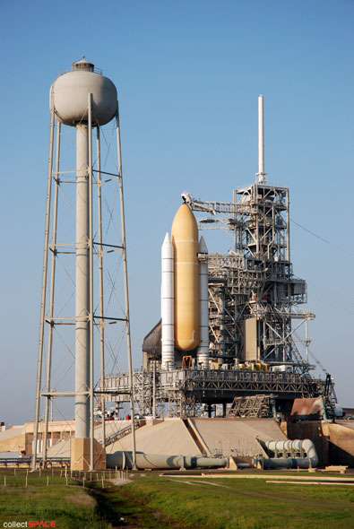 Atlantis and astronauts at the pad