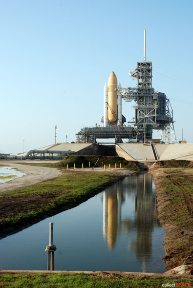 Atlantis and astronauts at the pad