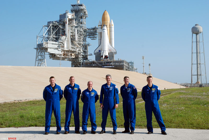 Atlantis and astronauts at the pad