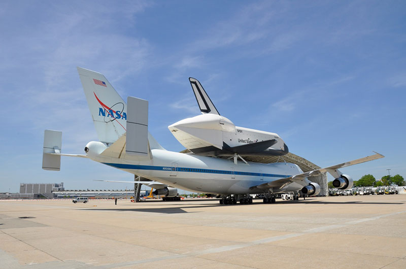 Space shuttle Enterprise hoisted off jumbo jet in New York