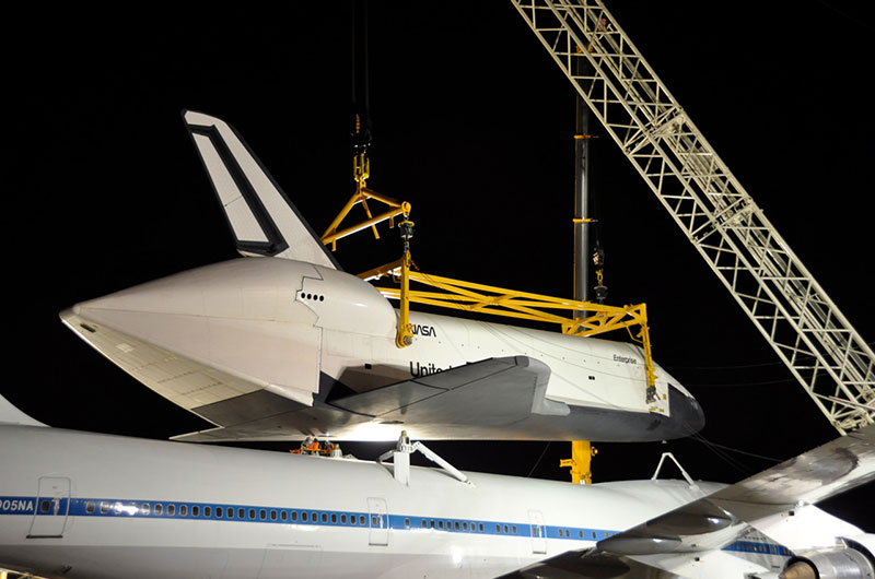 Space shuttle Enterprise hoisted off jumbo jet in New York