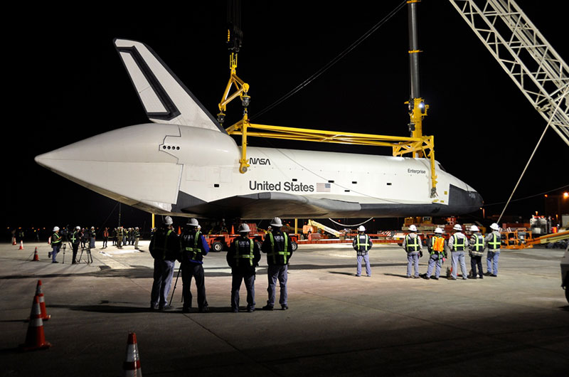 Space shuttle Enterprise hoisted off jumbo jet in New York