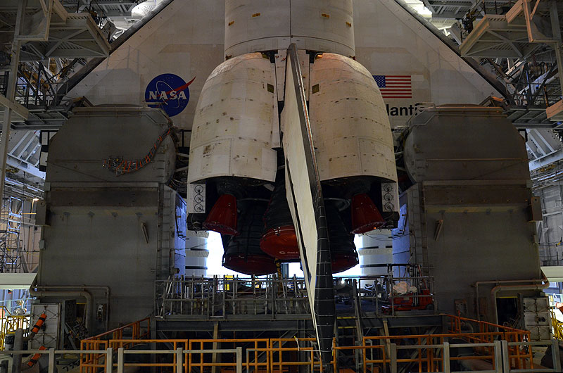 Final shuttle rolls out to launch pad as next-to-last lands