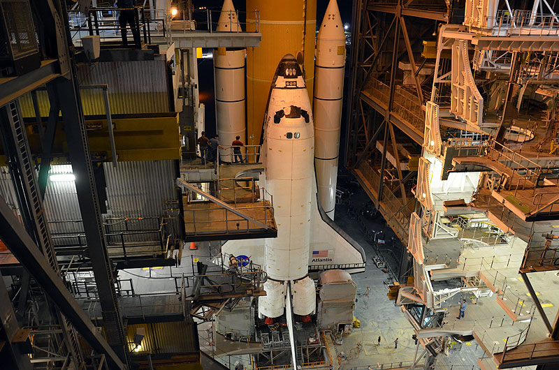 Final shuttle rolls out to launch pad as next-to-last lands