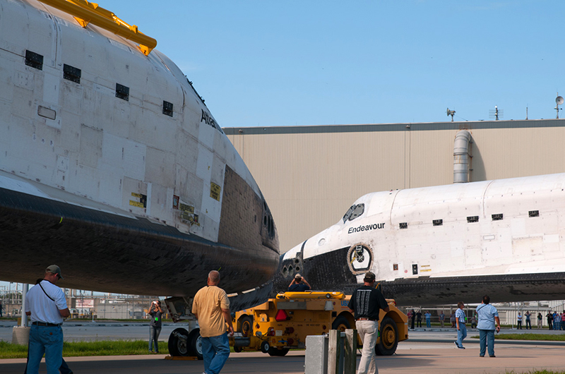 Trading places, space shuttles meet nose-to-nose for a final time